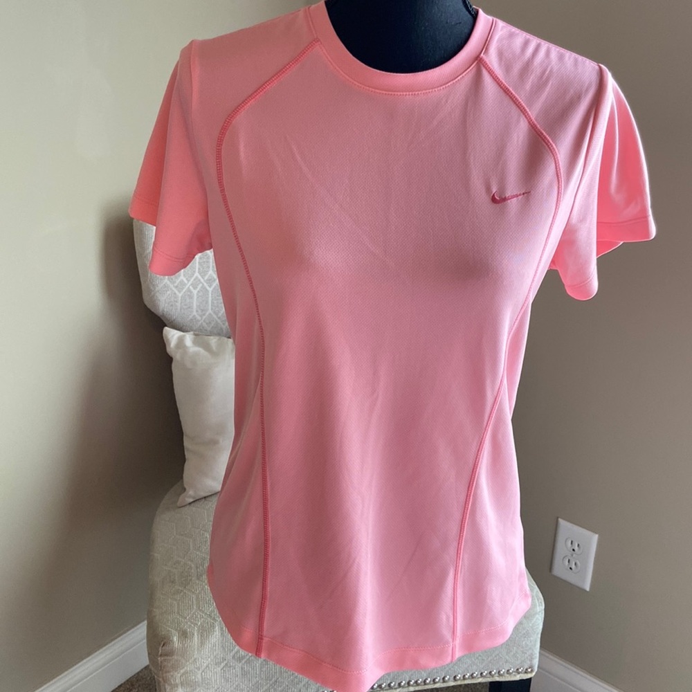 Women’s Nike short sleeve.  Pinky peach color.  Size Medium.  Gently used.